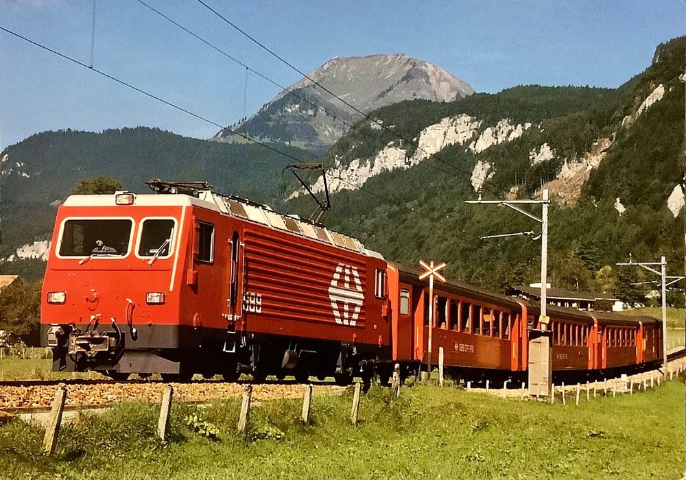 Akte Foto AK Brünigbahn Zug mit HGe 4 4 II bei Meiringen Kaufen