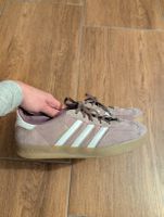 Purple adidas gazelle.