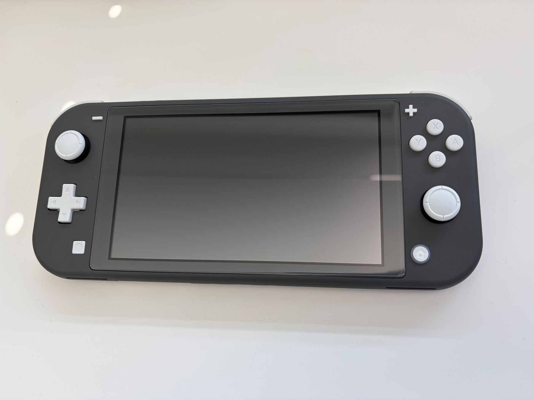 Nintendo Consoles: Nintendo Switch Lite Grau/Schwarz – Neuf (Voir description) à Reinach AG par mali.kes 1