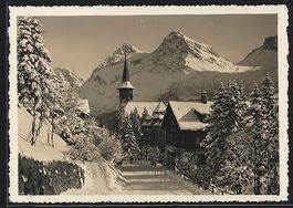 Arosa, Dorfstrasse mit Kirche im Winter