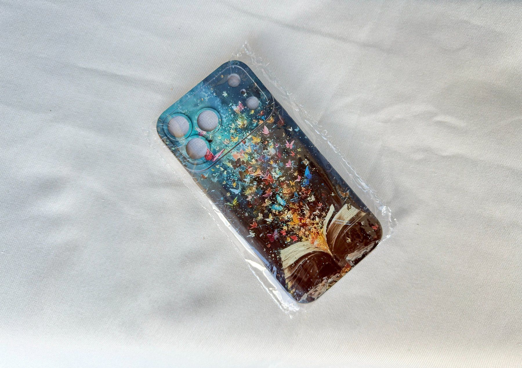 Apple Covers & Schutzfolien: Coque iPhone 17 Pro Max Papillons Livre Magique Pro Camera – Neu und originalverpackt aus Thônex von Suisse.Shopping 3