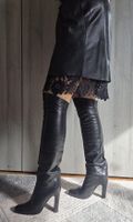 Bottes hautes en cuir noir, taille 38.