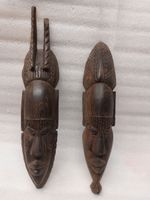2 Vintage African masks made of solid wood