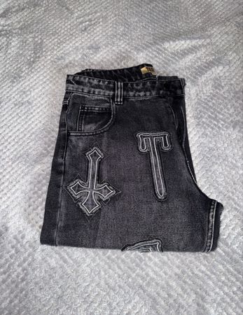 JEANS NOIR MOTIFS CROIX
