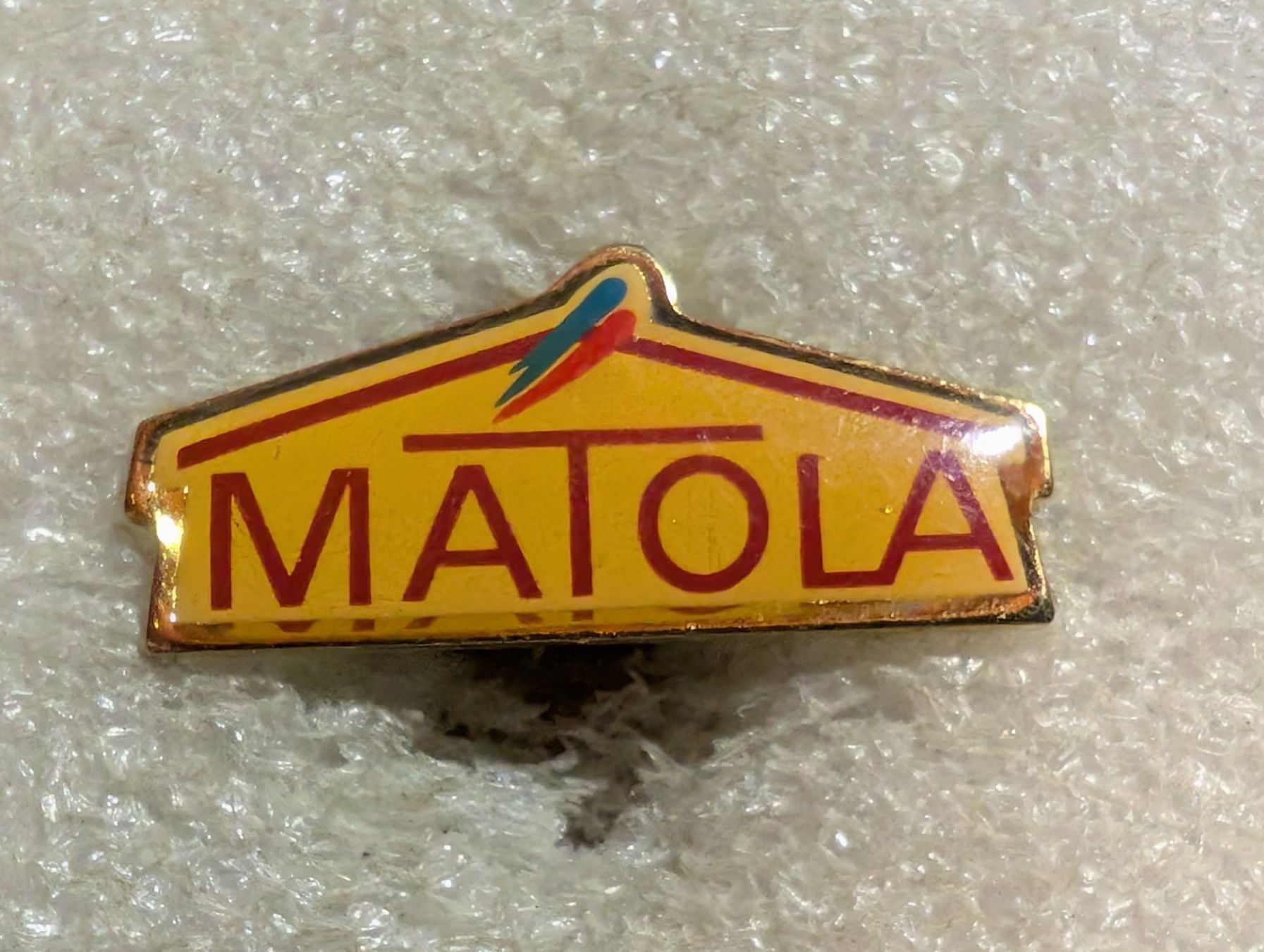 Placchette & Badge: Ansteckpin 60: Matola – Usato da Oppligen venduto da Pin-Fall-Shop