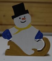 Schneemann auf Schlitten aus Holz