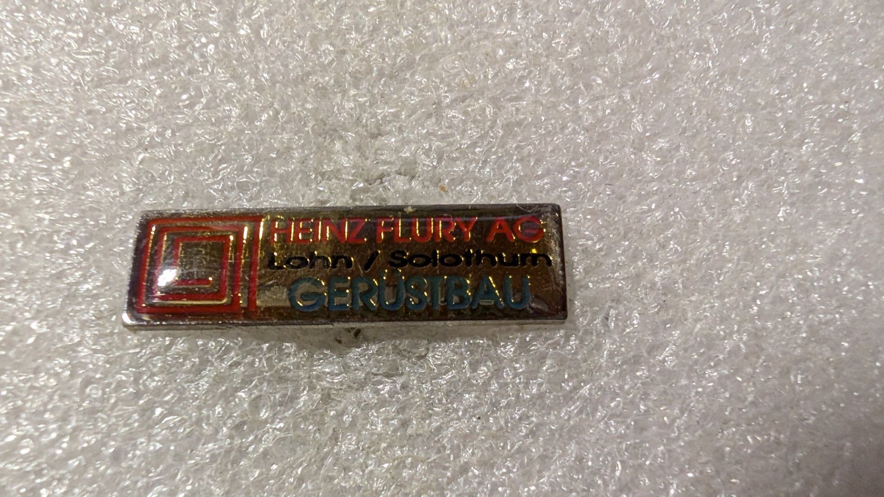 Plaketten & Abzeichen: Ansteckpin 206: Heinz Flury AG – Gebraucht aus Oppligen von Pin-Fall-Shop