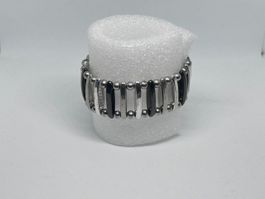 Bracciale elastico di bigiotteria a barre argentate e nere