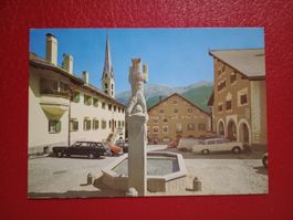 Zuoz Engadin Dorfplatz Kirche alte Autos