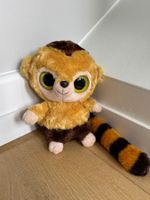 Peluche grandes yeux marron et jaune rayé.