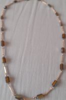 Collana unica con perle di vetro ambrato