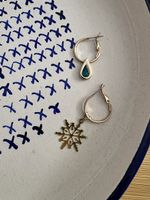 Set of hoop earrings with snowflake and teardrop charms 