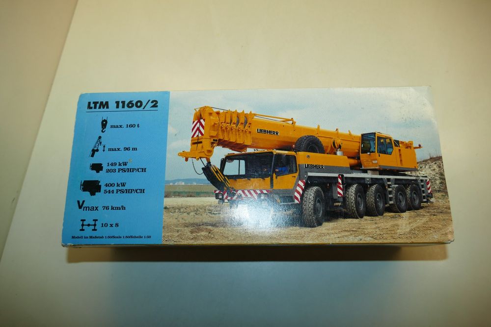Camion Conrad Talbert Komatsu 1/50 – Porte-engins Jaune – Réf 6412/02