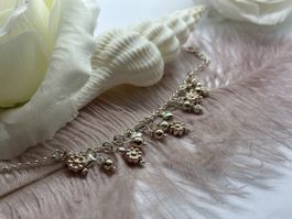 Silberarmband mit rose vergoldeten Anhängern