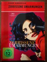 Zerrissene Umarmungen