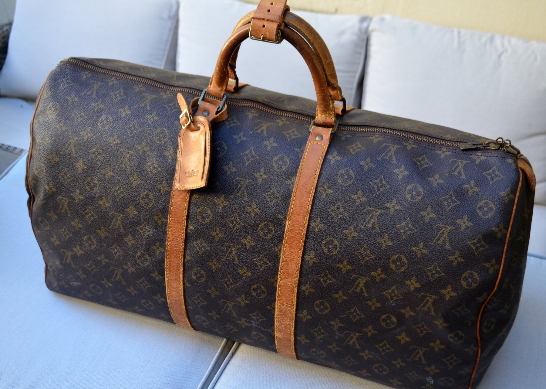 Louis Vuitton Taschen: Louis Vuitton Keepall 60 Monogram – Defekt aus Collonges von Auganien
