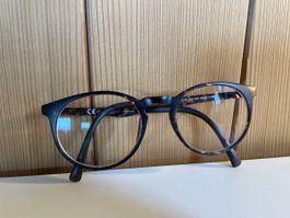 Brille inklusive Sonnenschutz