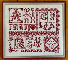 Tableau au Point de croix - Alphabet rouge brodé
