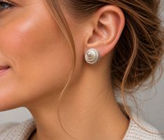 Ohrringe mit Spiralmotiv in Silber