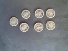 7 Knöpfe