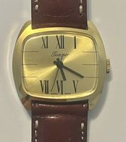 Montre Tiano vintage dorée, bracelet cuir véritable