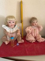 2 Puppen, 1 aus Porzellan und 1 zum Teil aus Porzellan