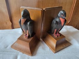 2 antike Buchstützen Holz Rabe Bücher Regal Stütze