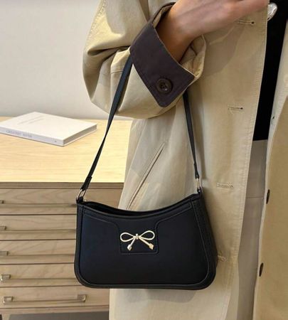 Sac à main noir avec noeud doré - Parfait pour l'hiver!