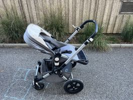 Poussette Bugaboo grise avec complément bébé. Bon état