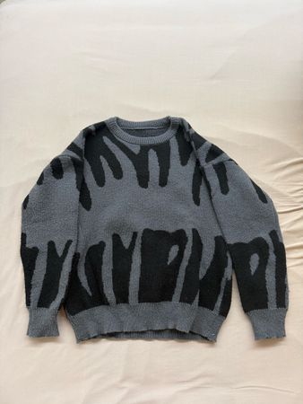 Pull en maille gris et noir taille M