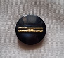 1 Knopf schwarz/ blau, 29 mm.