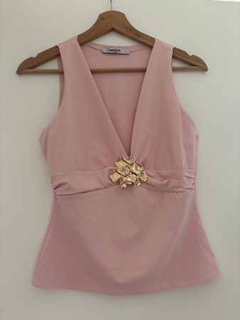 Haut rose sans manches taille petit L