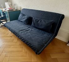 Canapé convertible bleu foncé deux coussins bon état
