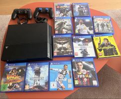 PlayStation 4 Konsole mit zwei Controllern und 12 Spielen