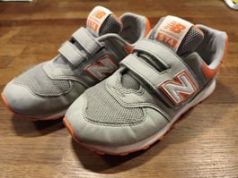Kinder Sneaker New Balance 574 grau orange Grösse 32.5 US 1 