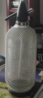 Sodaflasche  Glasflasche mit Schutzgitter 