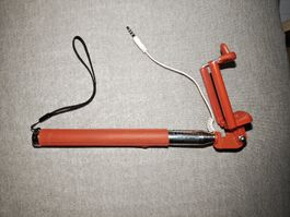 Perche à selfie Monopod rouge avec câble jack 