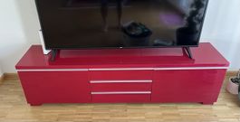 TV-Board rot glänzend mit drei Schubladen guter Zustand