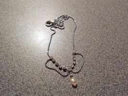 Armband silberfarbig vierecke/kleine Anh