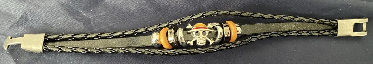 Bracciali & Braccialetti: One Piece Armband mit Strohhüte Emblem – Nuovo e nell'imballaggio originale da Allschwil venduto da Deal_Tiger99