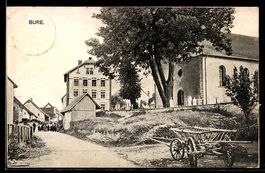 AK Bure, Straßenpartie mit Kirche und Handkarren