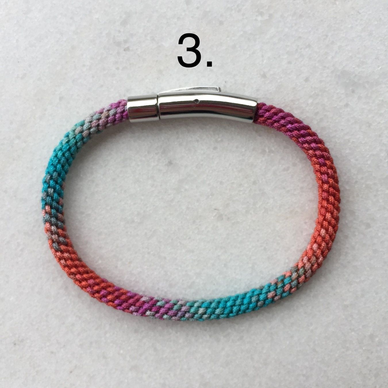 Bracciali & Braccialetti: Armband im Farbverlauf – Nuovo e nell'imballaggio originale da Luzern venduto da Pegasus003 3