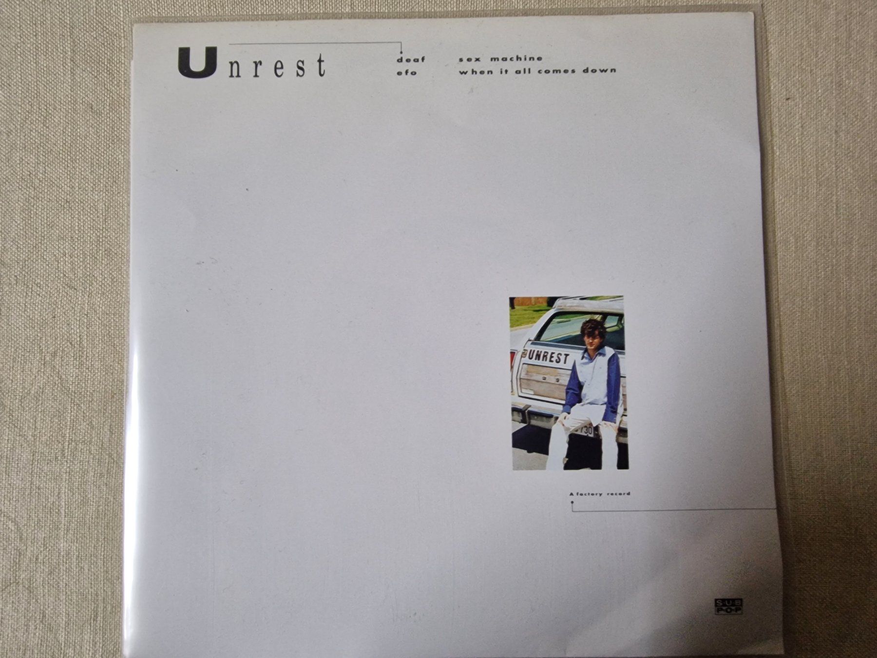 Vinyles: Unrest Single – A Factory Record – D'occasion à Root par atelier22
