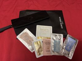 Leichte Kosmetiktrousse von Armani dazu Proben von Sisley