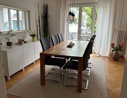 6 graue Schwingstühle