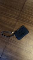 Michael Kors Mini Handgelenktasche, schwarz