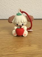Porte-cles figurine chien avec pomme etat comme neuf