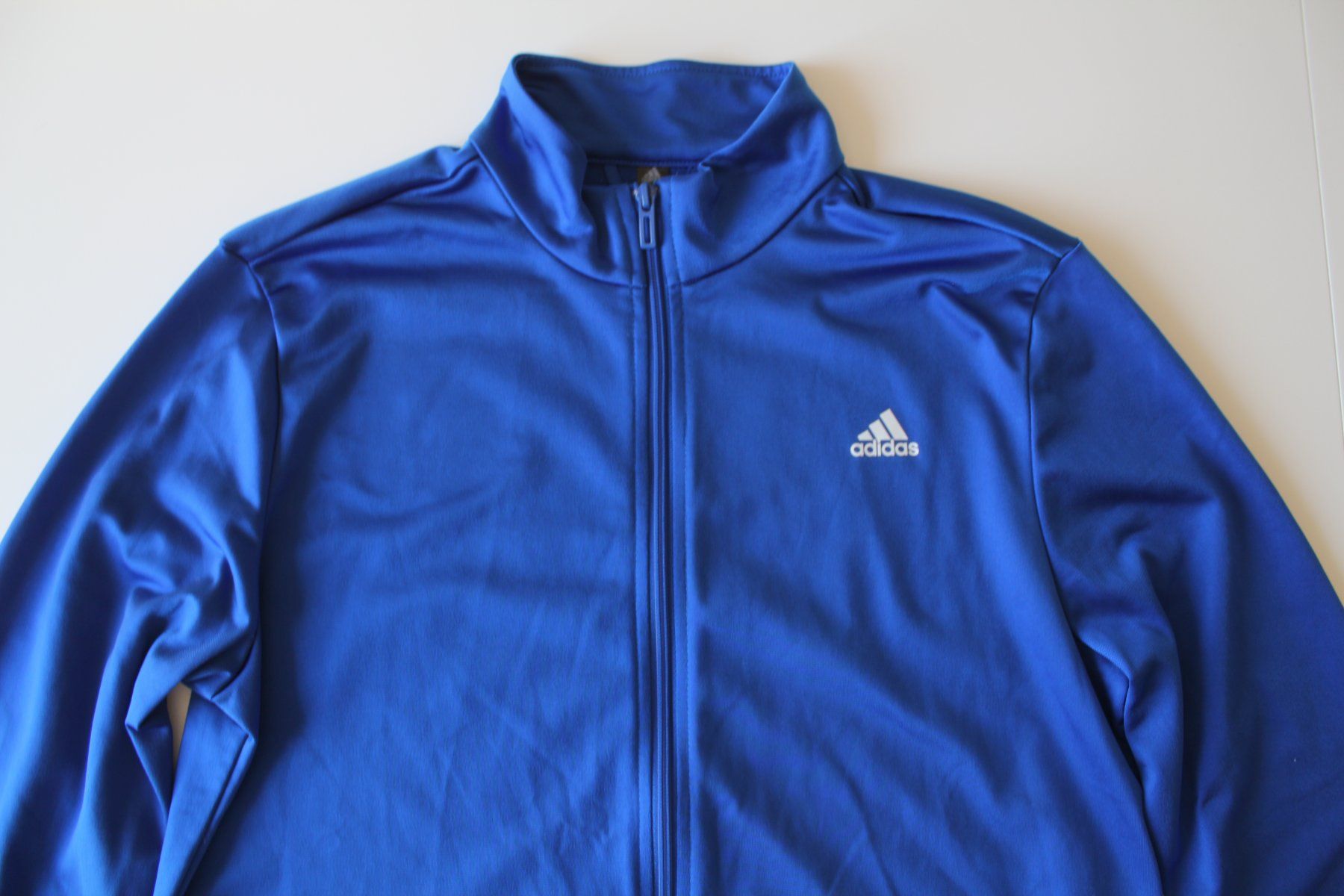 Adidas Giacche & Cappotti: Jaquette Adidas bleu t. 176 – Usato da Peseux venduto da Gilloss 1
