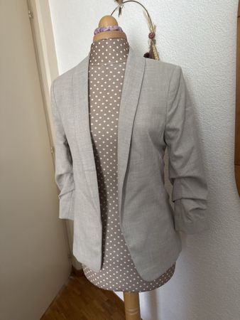 Veste mi-saison, manches 3/4, 2 poches latérales, taille 38