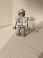 LEGO Minifigur namens „Robo Skeleton“ (Set-Nummer tlm048